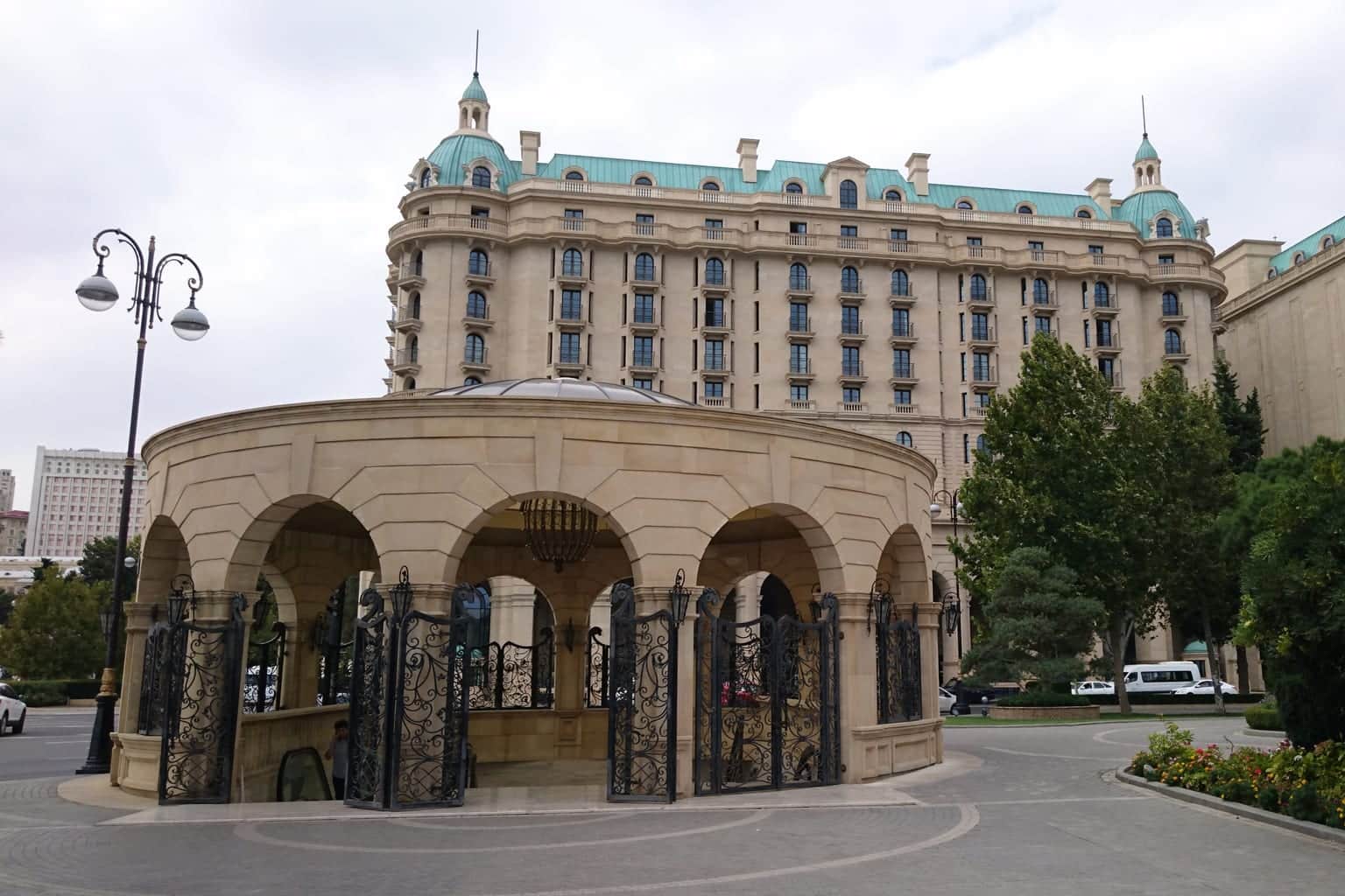Four Seasons Hotel Baku facade behind the domed metro pavilion on Neftchilar Avenue