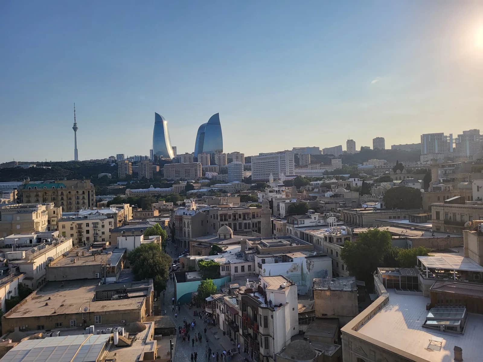 Baku Old City rooftops with the Flame Towers and television tower on the skyline