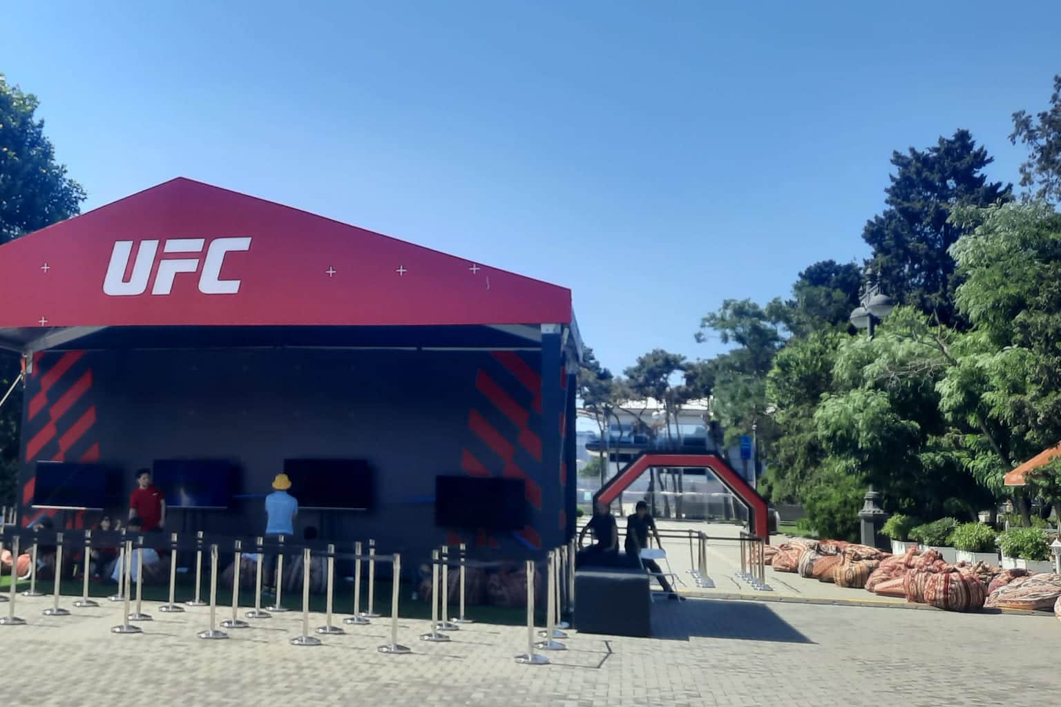 Branded activation stage with screens and stanchions set up on Baku Boulevard for a sports event