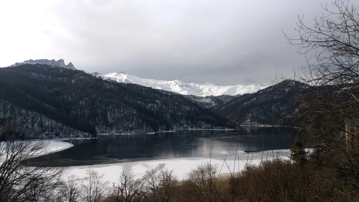 The clear blue alpine water of Lake Goygol below Mount Kapaz