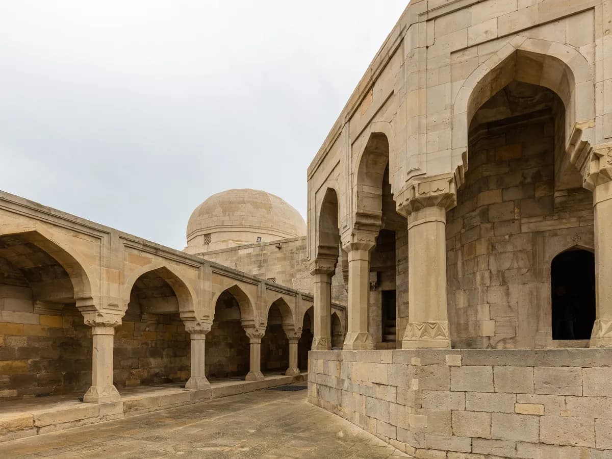 Stone arcades and a domed roof on a lower terrace of the Palace of the Shirvanshahs