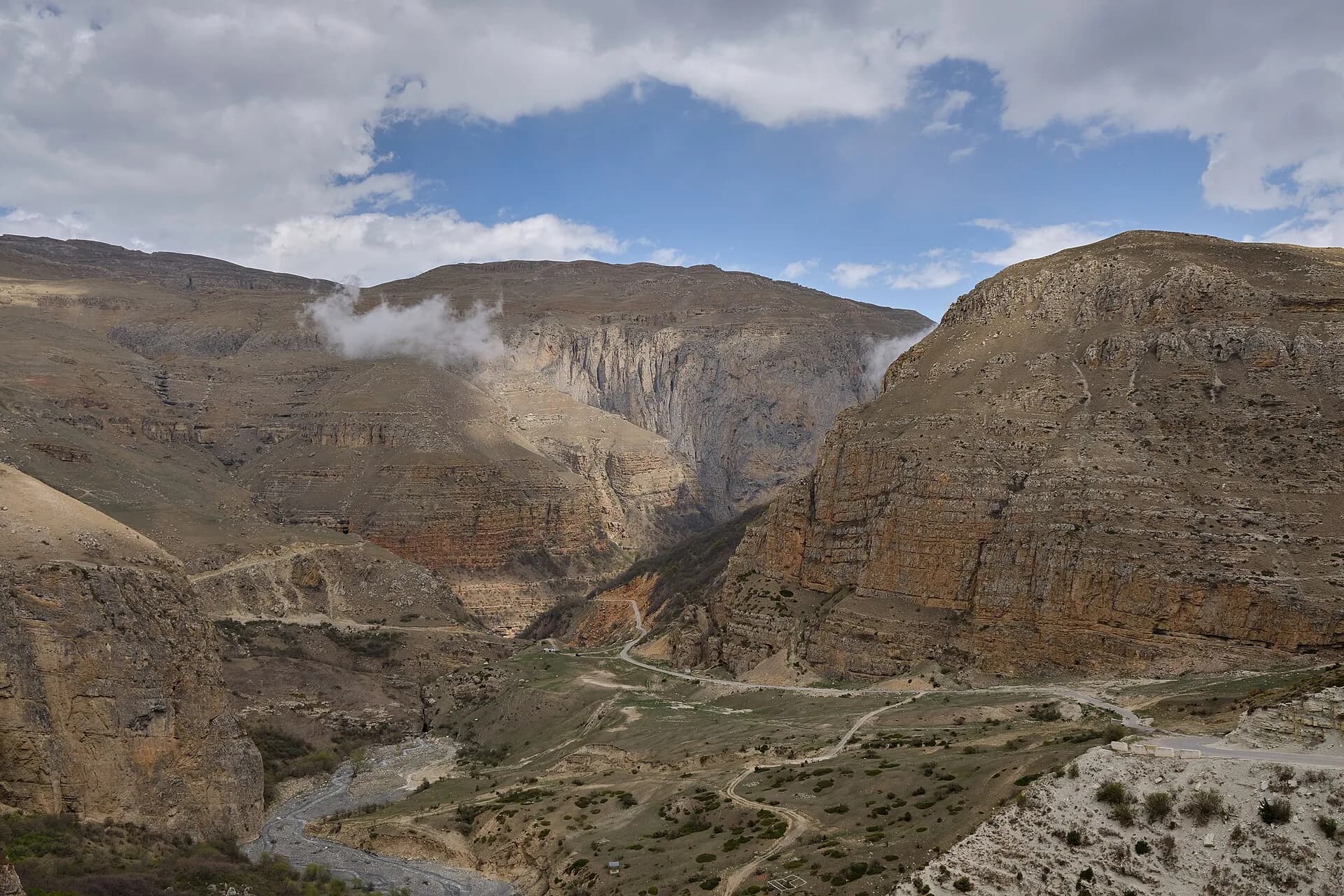 Mountain road winding toward Khinalig in the Greater Caucasus