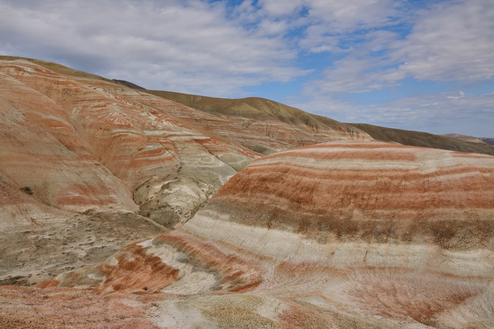 Red and pale striped hills of the Candy Cane Mountains in Khizi