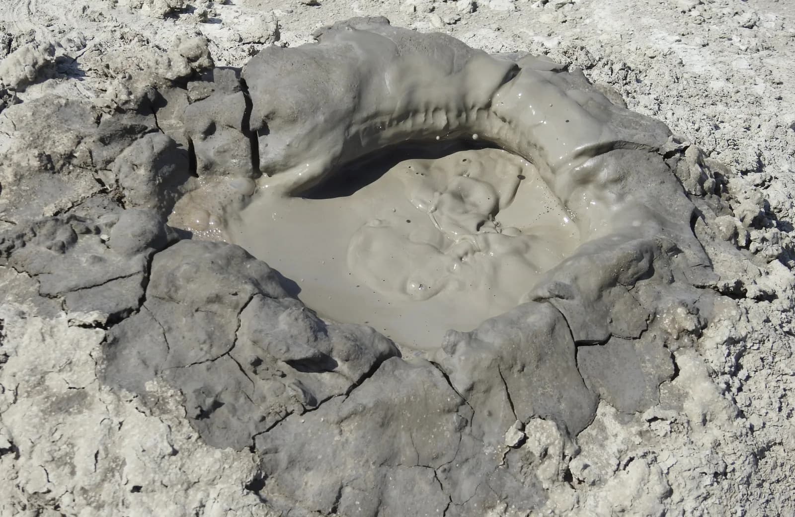 Mud bubbling from a crater in the Gobustan landscape