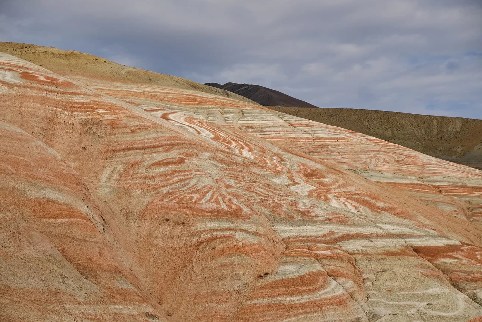 Red and pale striped hills in Khizi