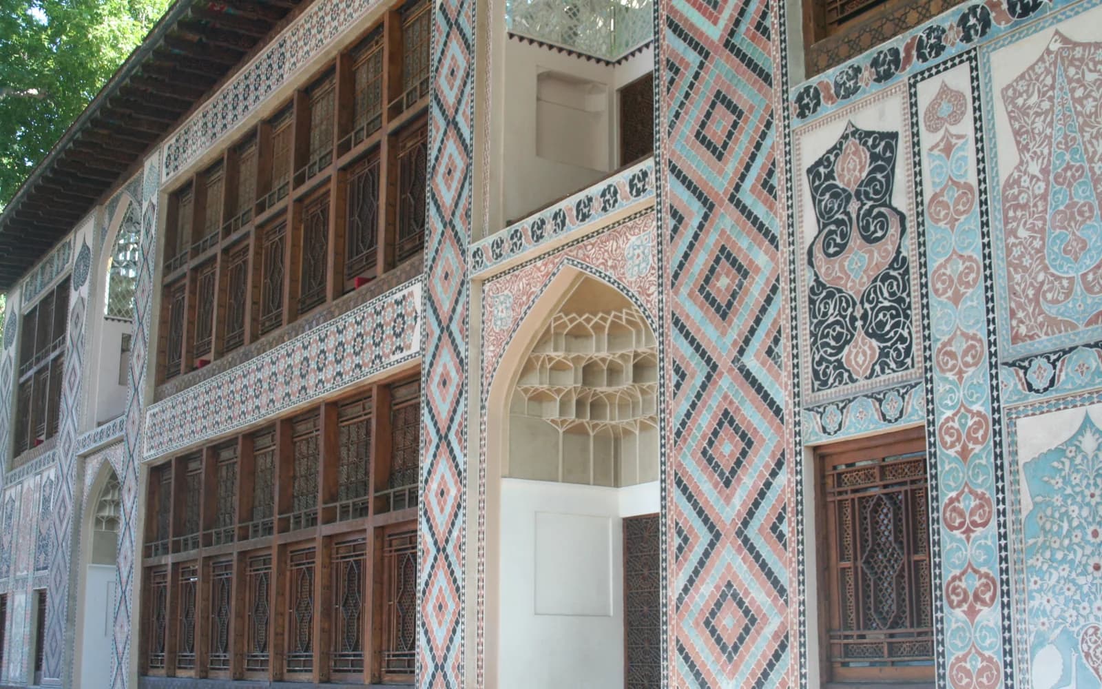 Painted wall and carved arch at the Sheki Khan Palace