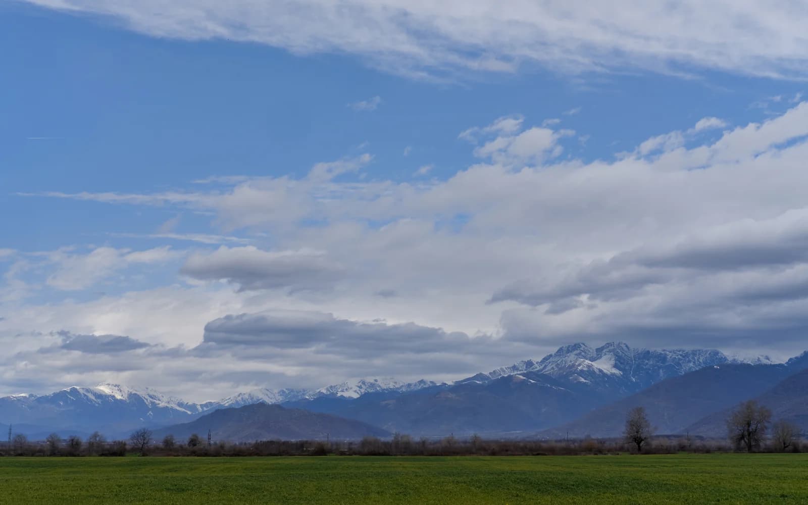 Caucasus mountains beyond fields in the Gabala region