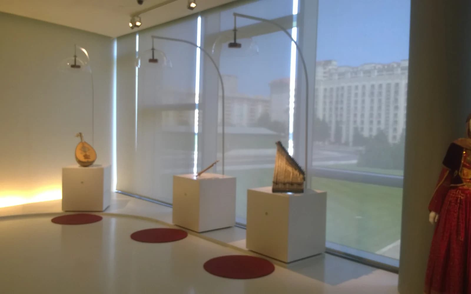 Museum objects displayed beside the windows of the Heydar Aliyev Center in Baku
