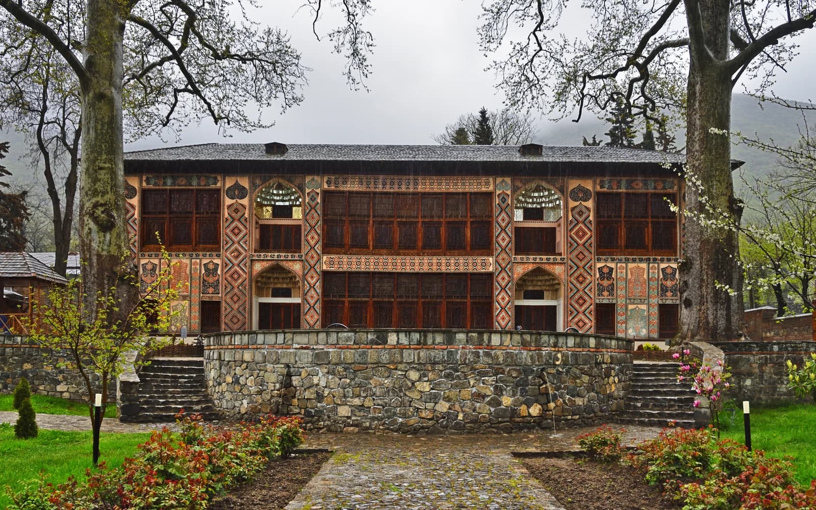 Sheki Khan Palace seen through trees and garden steps