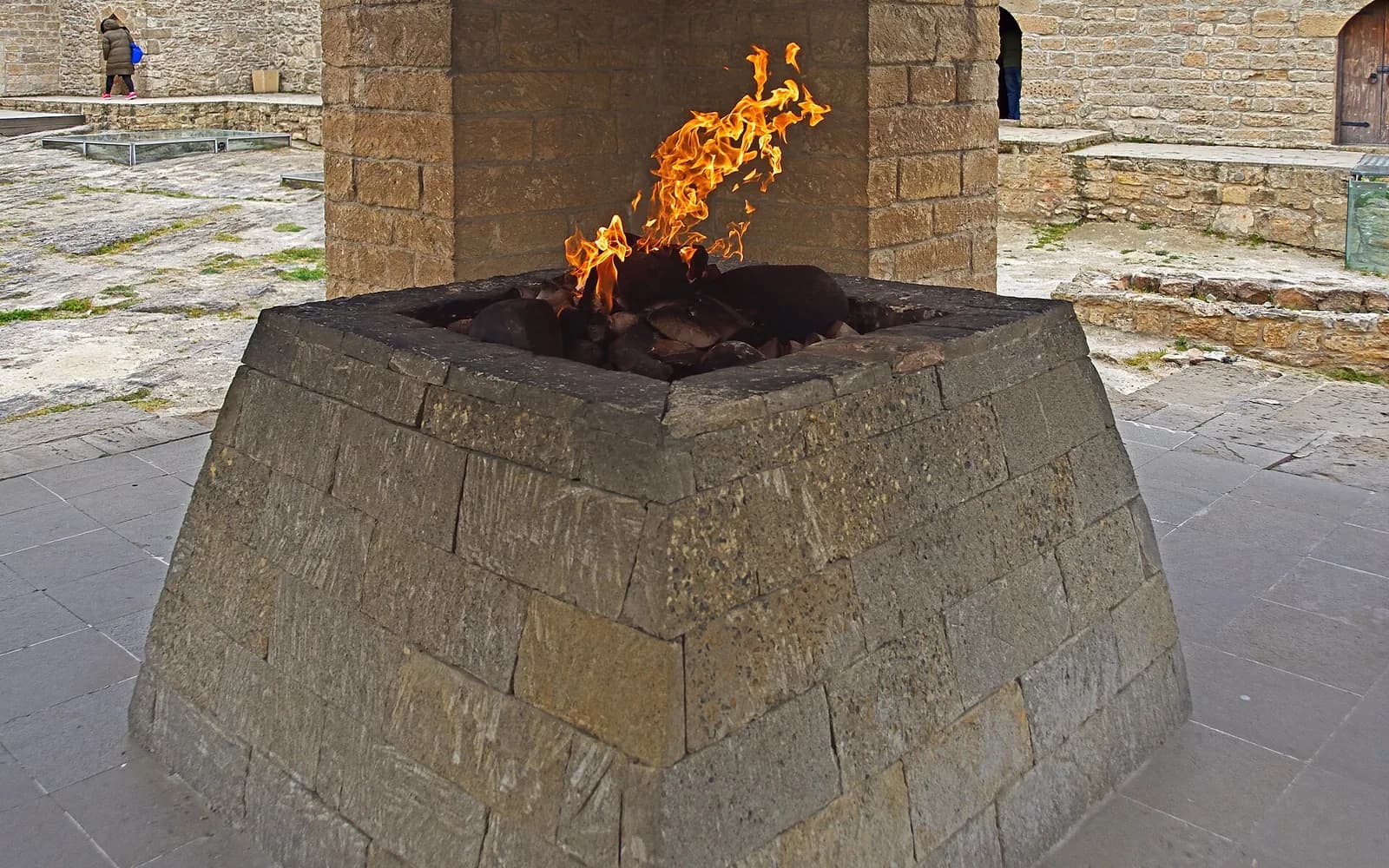 Flame burning in the stone fire altar at Ateshgah