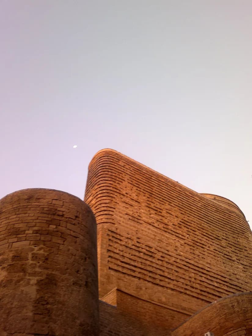 Maiden Tower in warm evening light in Baku Old City