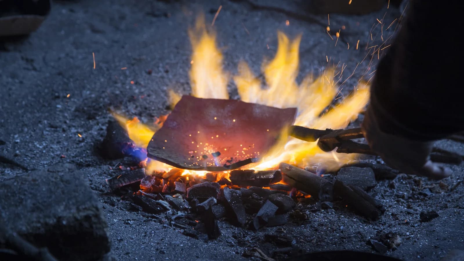 Copper vessel being heated in a Lahij coppersmith workshop