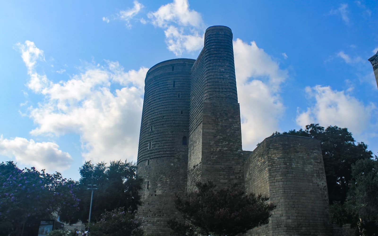 Maiden Tower beneath a bright summer sky in Baku