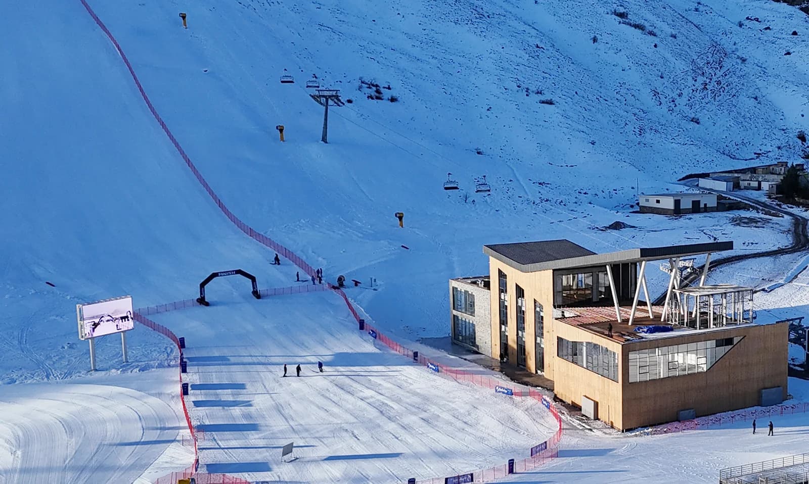 Snow-covered ski-center buildings and slopes at Shahdag in 2025