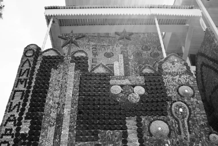 Glass-bottle patterns on the facade of Ganja's Bottle House
