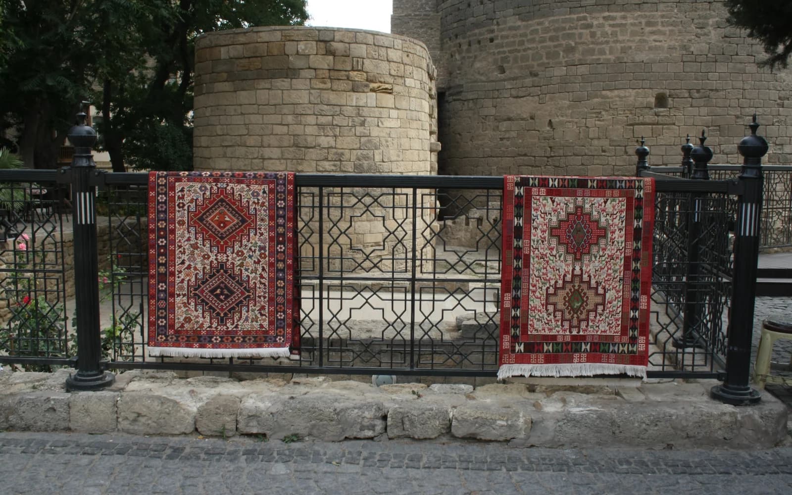 Azerbaijani carpets displayed beside the Maiden Tower complex