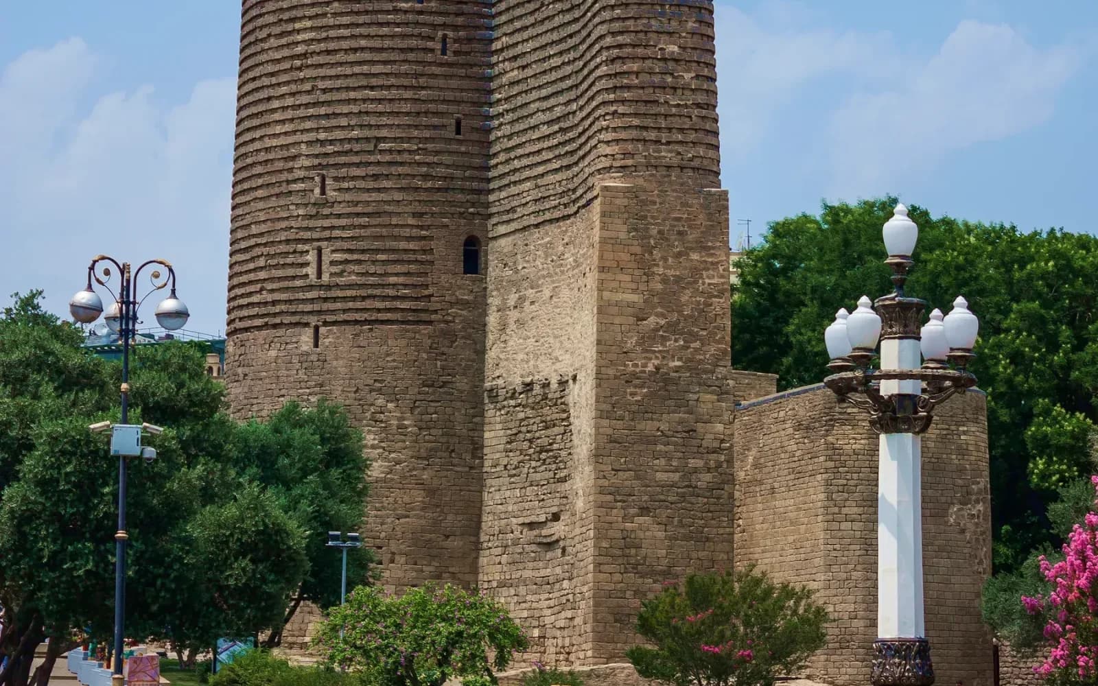 Maiden Tower, trees and street lamps in Baku Old City