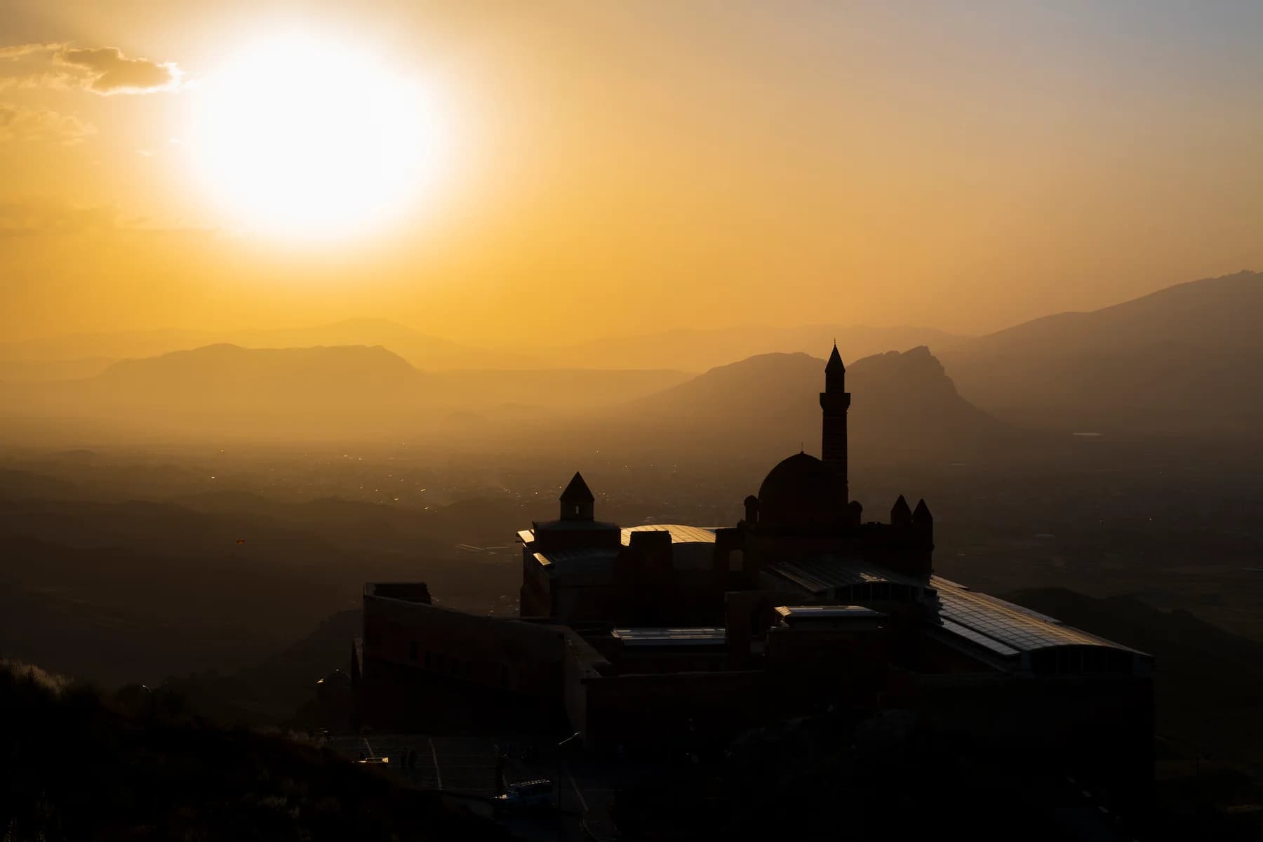 Ishak Pasha Palace silhouetted against a golden evening sky near Dogubayazit