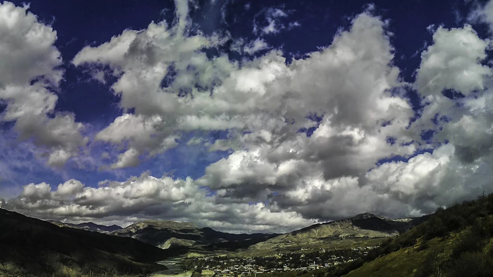 Mountain valley and cloudscape near Lahij, Azerbaijan