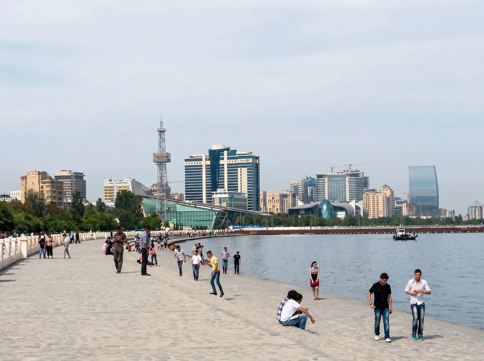 The Caspian seaside promenade of Baku Boulevard with the Baku Eye at dusk