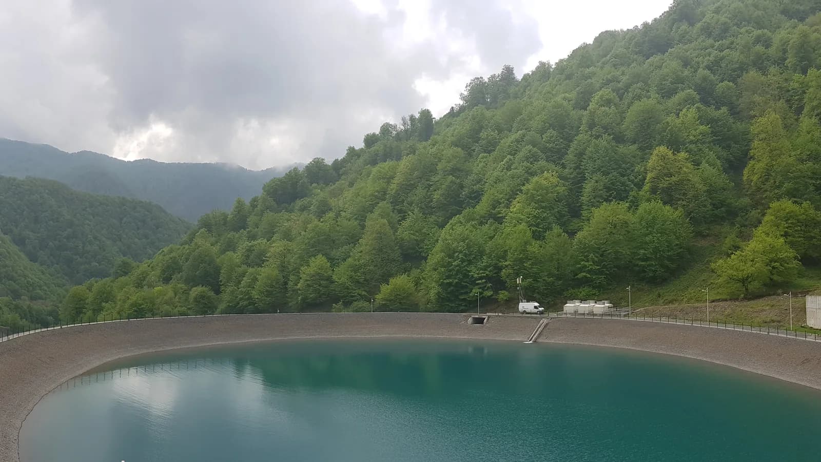 A reservoir beneath forested mountain slopes in Gabala, Azerbaijan
