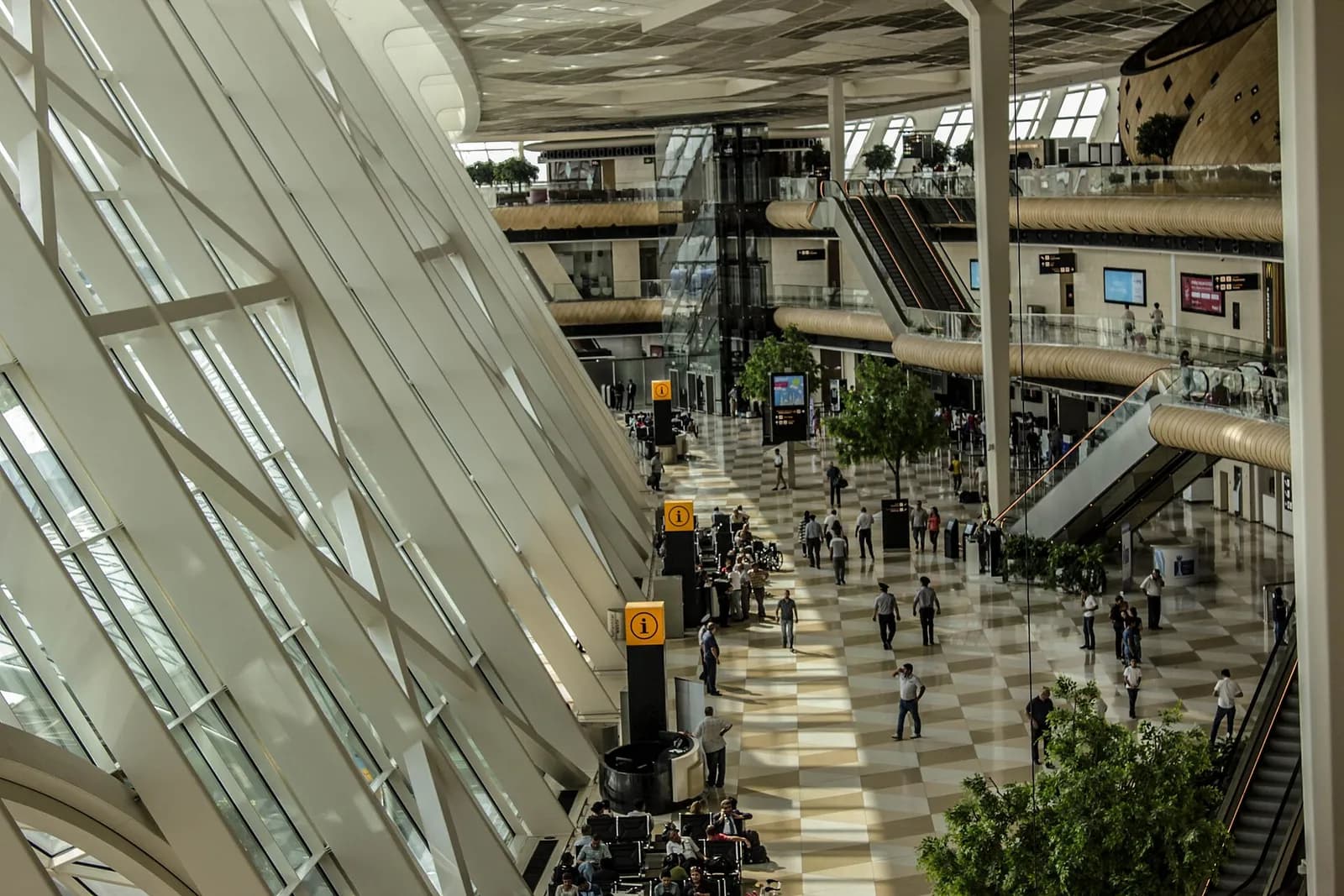The concourse at Heydar Aliyev airport in Baku, its glass wall and the timber shell above