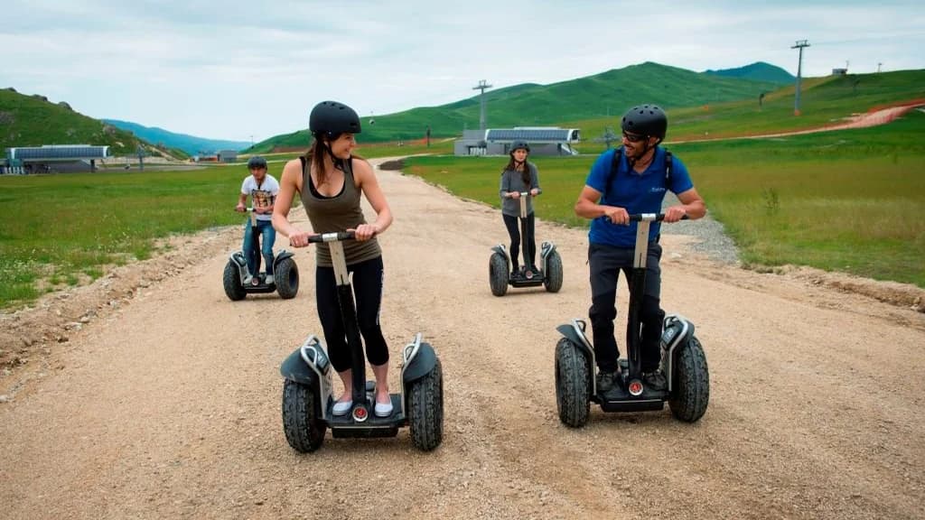 Visitors riding Segways on a summer trail at Shahdag Mountain Resort
