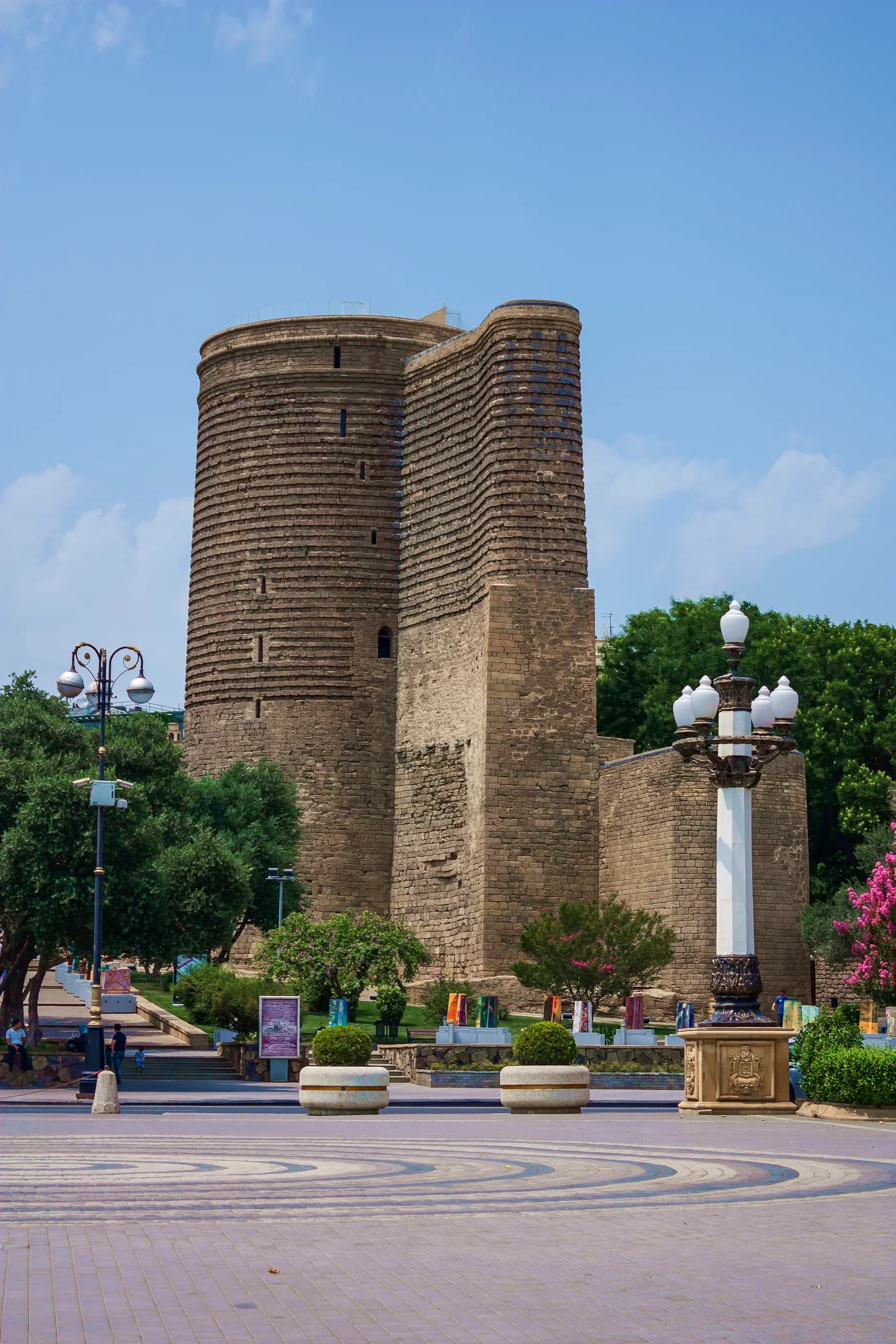 Maiden Tower, trees and street lamps in Baku Old City
